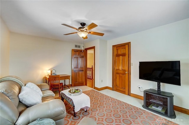 carpeted living room with ceiling fan