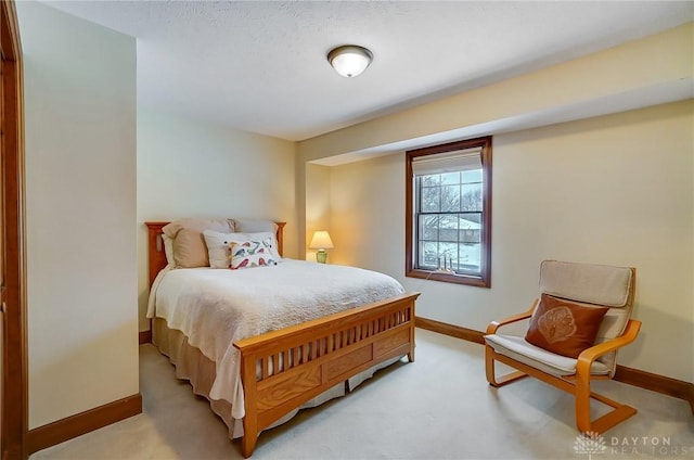 bedroom featuring light carpet