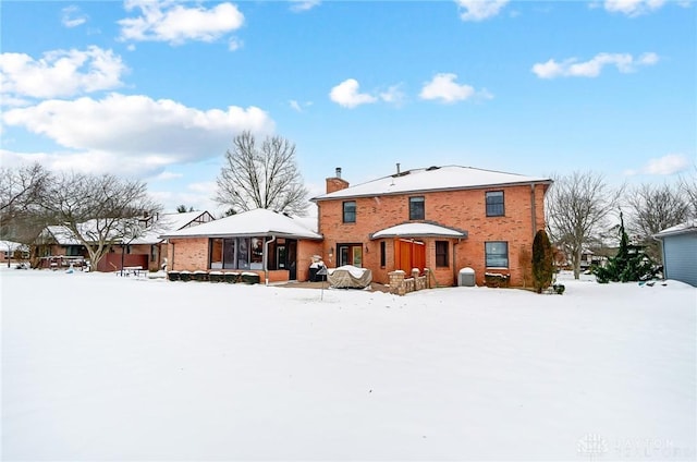 view of snow covered house