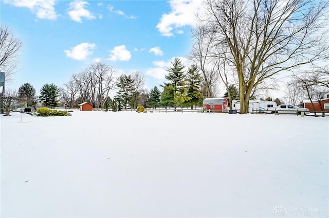 view of yard layered in snow