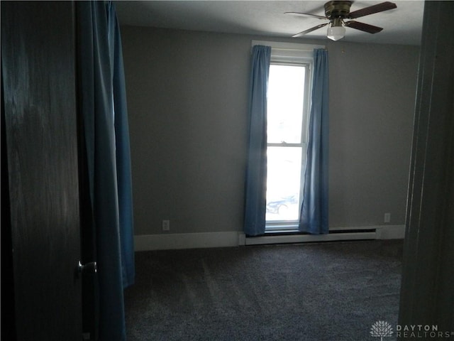 carpeted empty room featuring ceiling fan