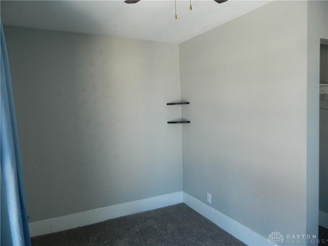 spare room featuring carpet floors and ceiling fan