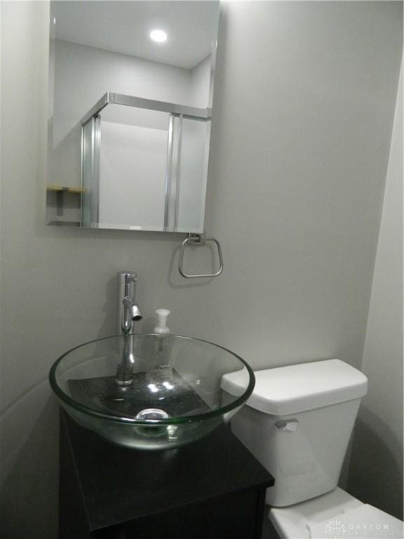 bathroom featuring toilet and sink