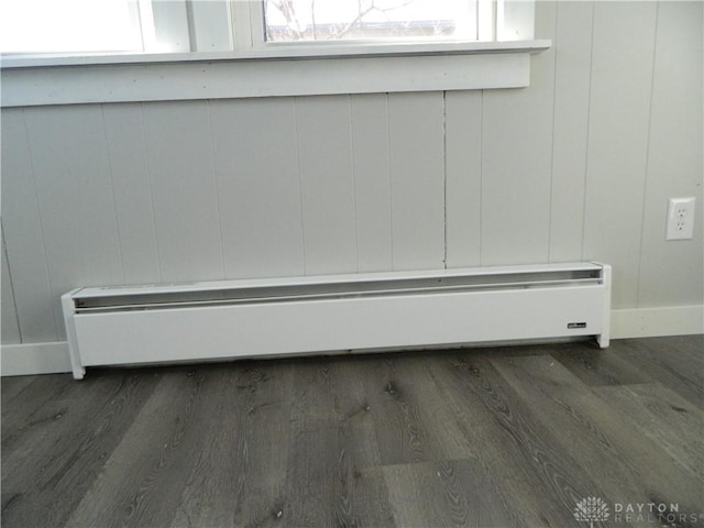 details with wood-type flooring and a baseboard radiator