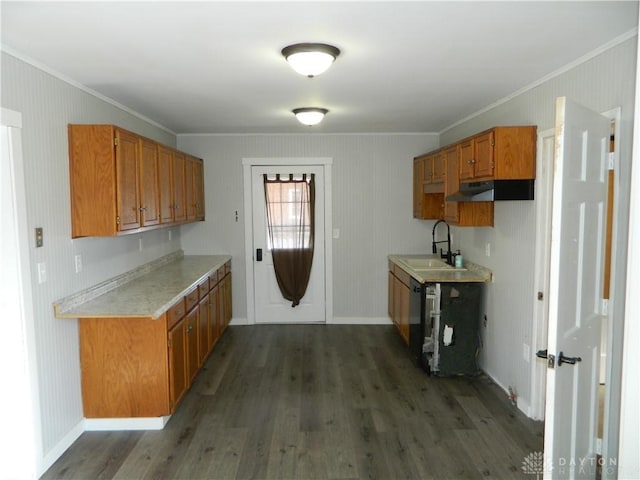 kitchen with dark wood-type flooring, crown molding, black dishwasher, and sink