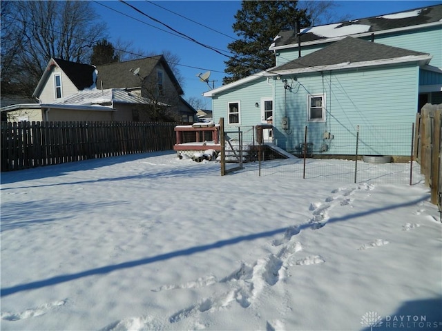 view of snow covered property