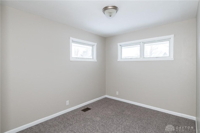 spare room featuring carpet flooring