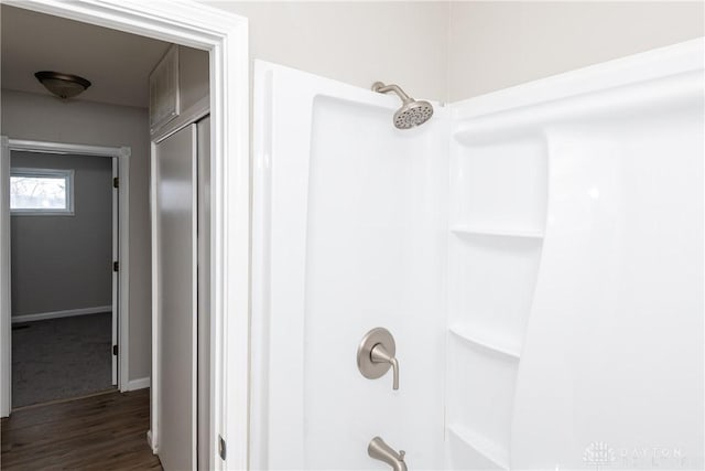 bathroom featuring a shower and wood-type flooring