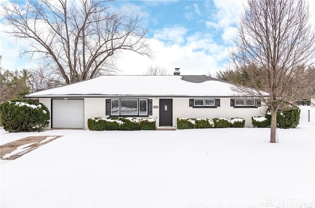 single story home with a garage