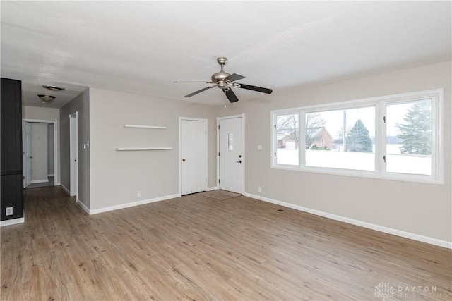 unfurnished living room with ceiling fan and light hardwood / wood-style flooring