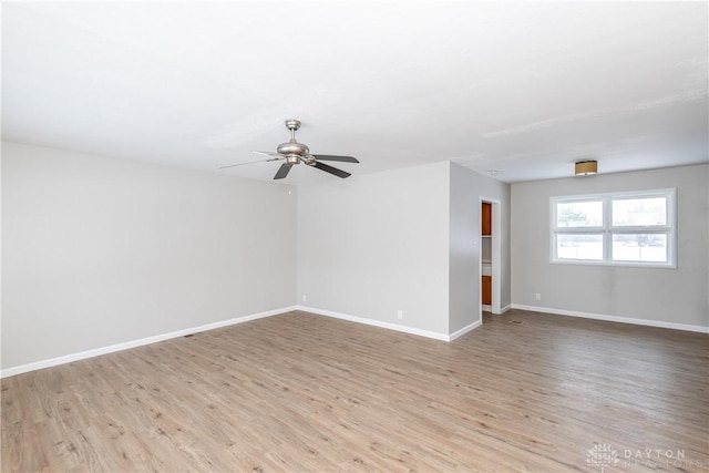 unfurnished room featuring ceiling fan and light hardwood / wood-style floors