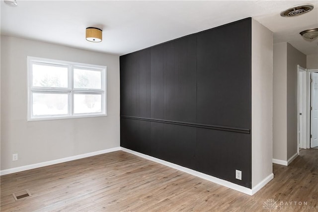 spare room featuring hardwood / wood-style flooring