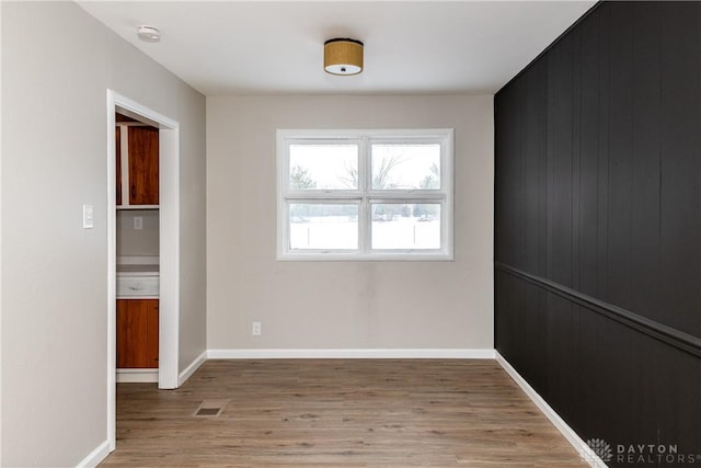 unfurnished room featuring light hardwood / wood-style floors