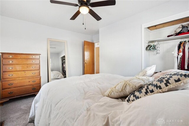 carpeted bedroom featuring a closet and ceiling fan