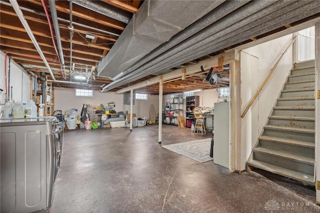 basement with washer and clothes dryer