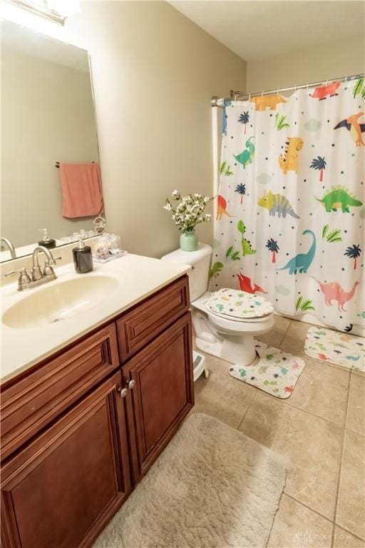 bathroom featuring walk in shower, vanity, and toilet