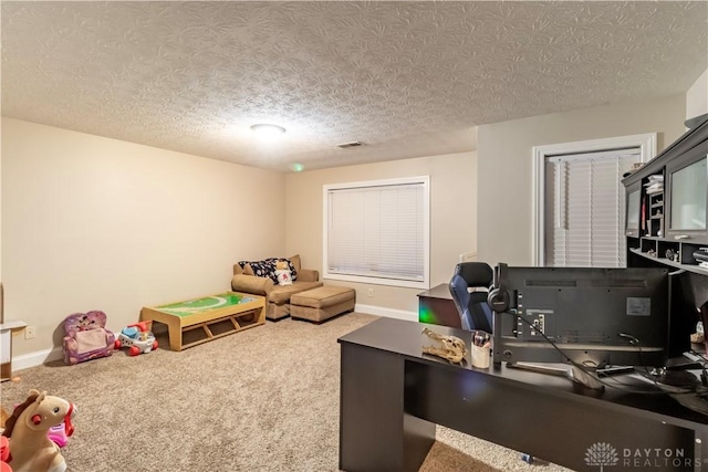 interior space featuring a textured ceiling and carpet floors