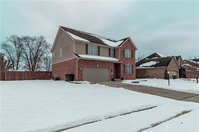 view of property featuring central AC unit and a garage