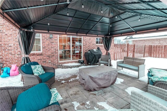 view of patio / terrace featuring a gazebo, area for grilling, and an outdoor hangout area