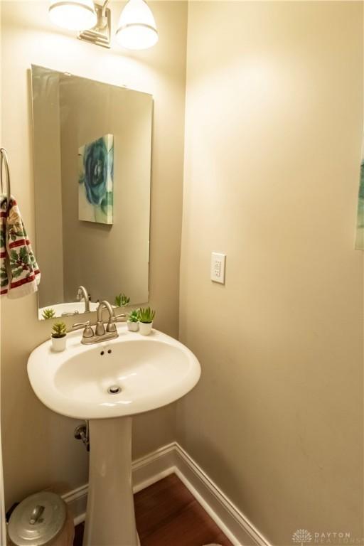 bathroom with hardwood / wood-style floors