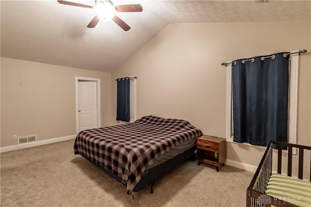 carpeted bedroom with lofted ceiling and ceiling fan