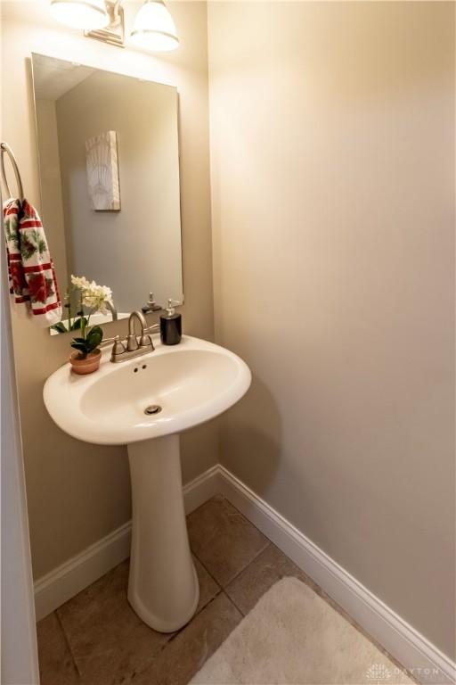 bathroom with tile patterned floors and sink