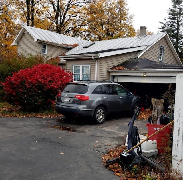 view of side of home featuring a garage