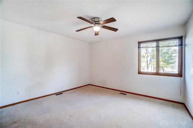 carpeted empty room with ceiling fan