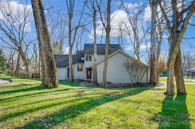 view of home's exterior featuring a lawn