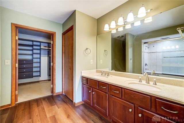 bathroom featuring hardwood / wood-style flooring and vanity