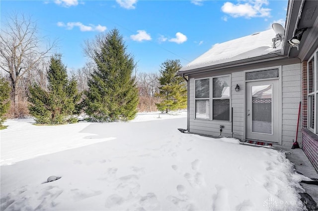 view of yard covered in snow