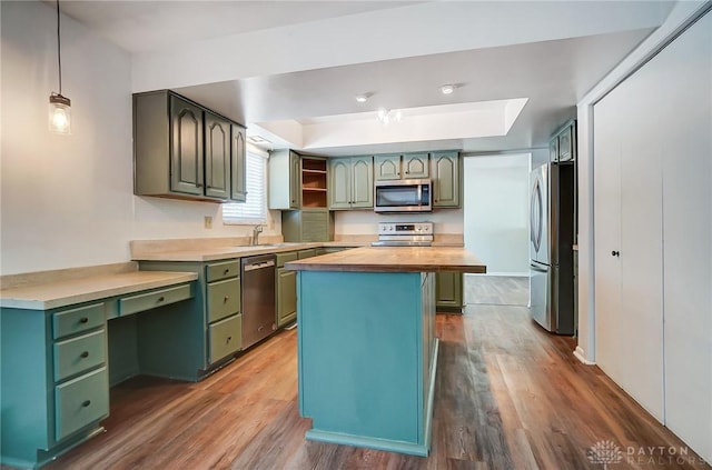 kitchen with pendant lighting, a center island, wood counters, dark wood-type flooring, and stainless steel appliances