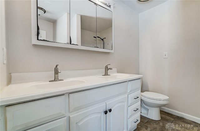 bathroom with toilet and vanity