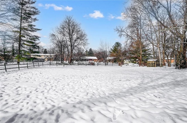 view of yard layered in snow