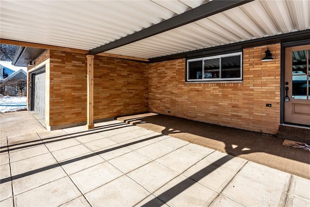 view of patio featuring a garage