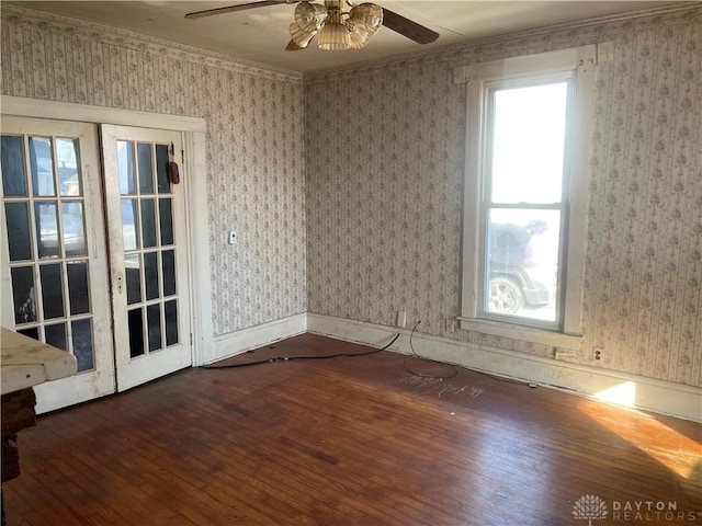 unfurnished room with ceiling fan and dark hardwood / wood-style flooring