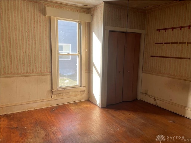 unfurnished room featuring hardwood / wood-style flooring