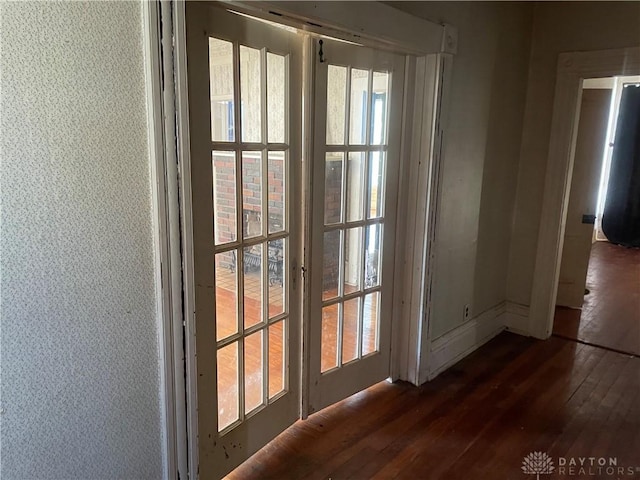 entryway with dark wood-type flooring