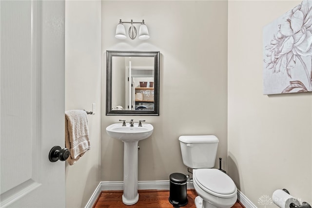 bathroom featuring sink and toilet