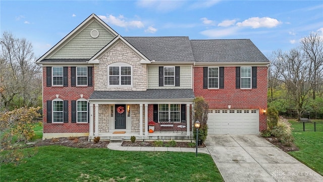 view of front of property featuring a front lawn, a garage, and a porch