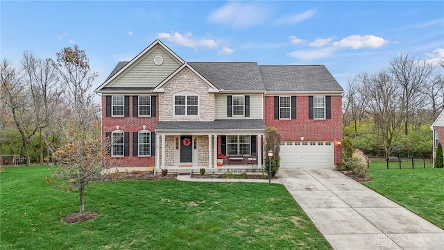 view of front of house with a porch, a front yard, stone siding, and driveway