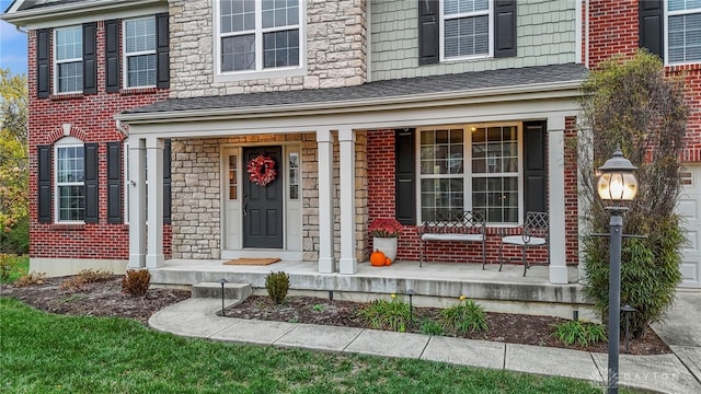 property entrance with a porch and a garage