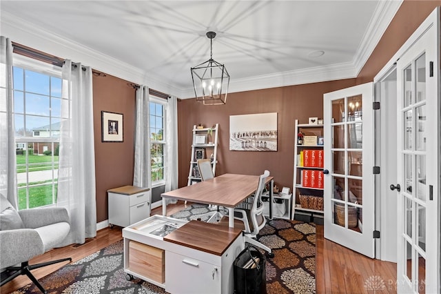 office featuring french doors, crown molding, a chandelier, and light hardwood / wood-style flooring