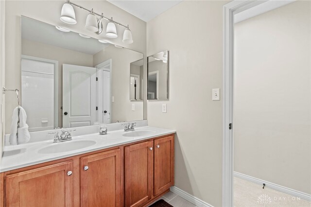 bathroom featuring tile patterned floors and vanity