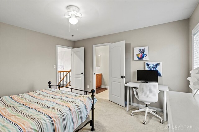 carpeted bedroom with ensuite bath