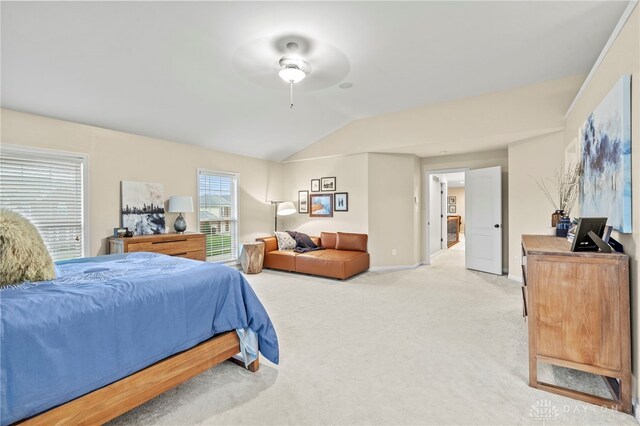 bedroom with ceiling fan, carpet, and vaulted ceiling