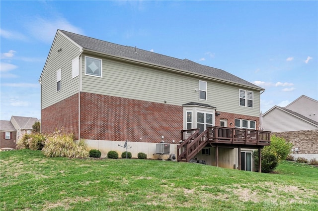 back of property featuring a deck and a yard