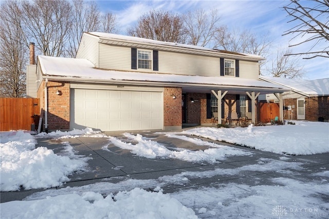 view of front of home featuring covered porch and a garage