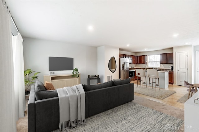 living room with light hardwood / wood-style flooring