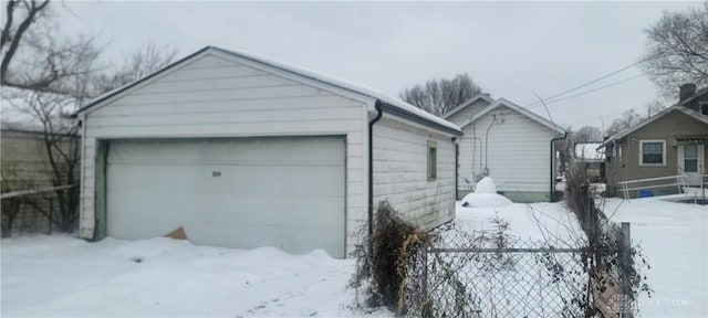 view of snow covered garage